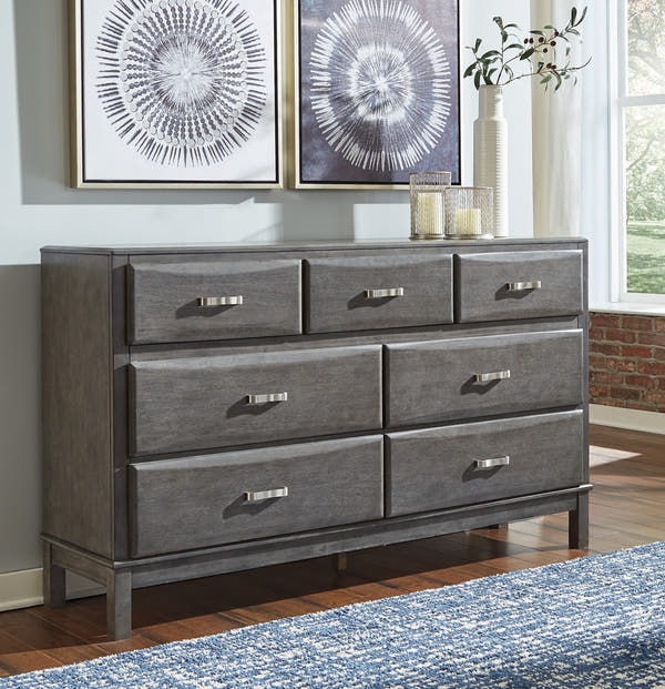Caitbrook Gray Dresser in a bedroom