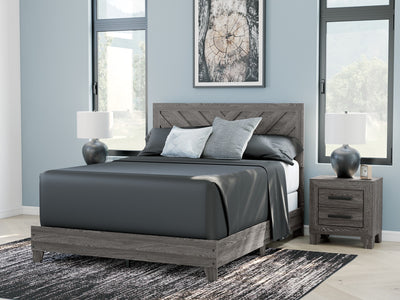 Sylveri Warm Gray Chevron Panel Bed in a bedroom