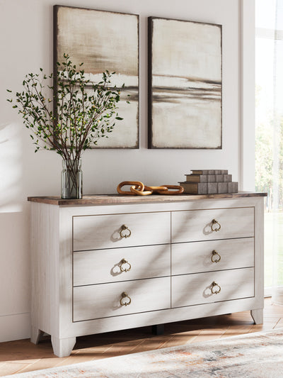 Laigmeyer Two-tone Six Drawer Dresser in a bedroom