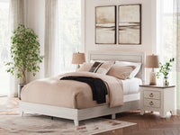 Laigmeyer Whitewash Panel Bed in a bedroom