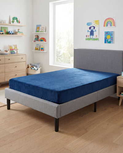 Blue Kids Mattress in child's bedroom featuring Omne mattress