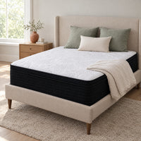 Classic Hybrid 13 inch mattress with white knit top on an upholstered bed