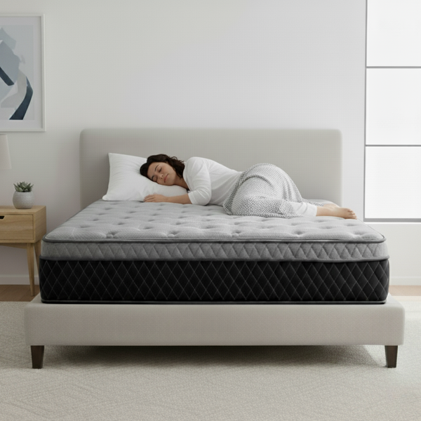 Woman sleeping peacefully on Classic Hybrid mattress featuring Omne Sleep